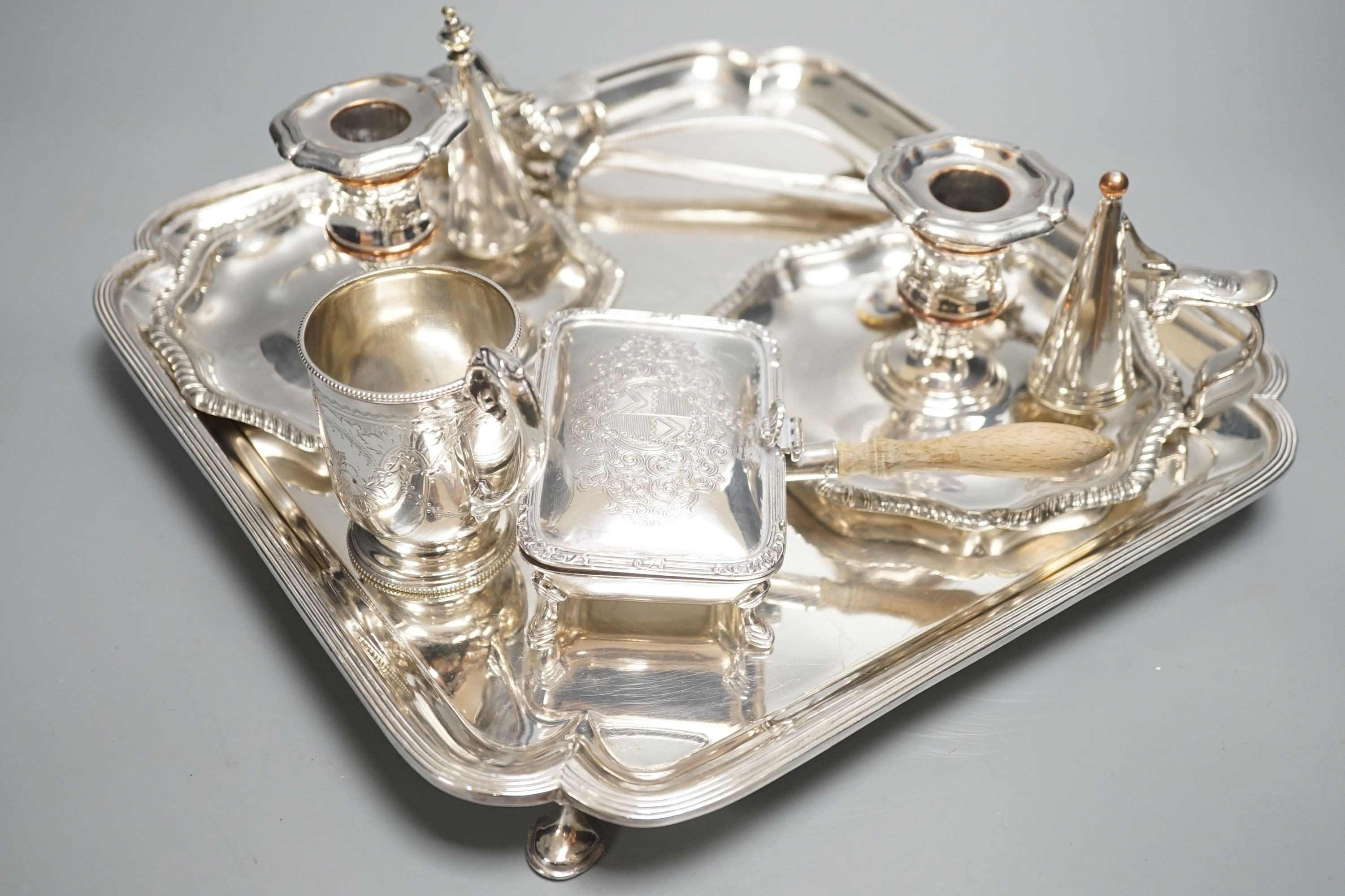 A plated salver, a pair of chambersticks and other plated flatwares